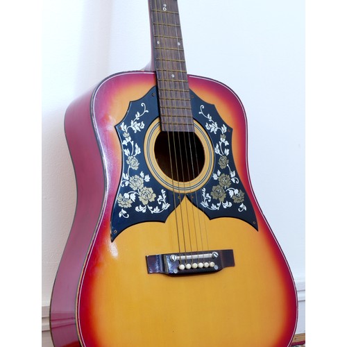 262 - A unbranded acoustic guitar, model No K235, sunburst colourway with twin scratch guards, decorated w... 