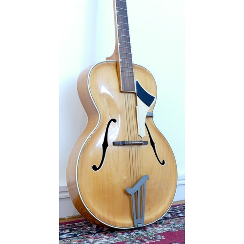 265 - A unbranded acoustic guitar, blonde natural colourway with cream scratch guard, headstock and trim, ... 