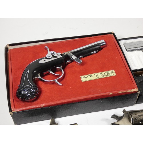 320 - A collection of novelty gas cigarette lighters, in the form of pistols, table and pocket examples.