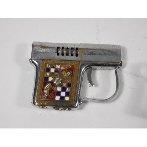 321 - Four 1950/60s novelty petrol cigarette lighters in the forms of pistols. (4)