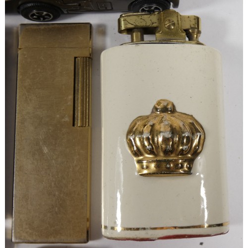 328 - A collection of pocket cigarette lighters, petrol and gas filled examples.