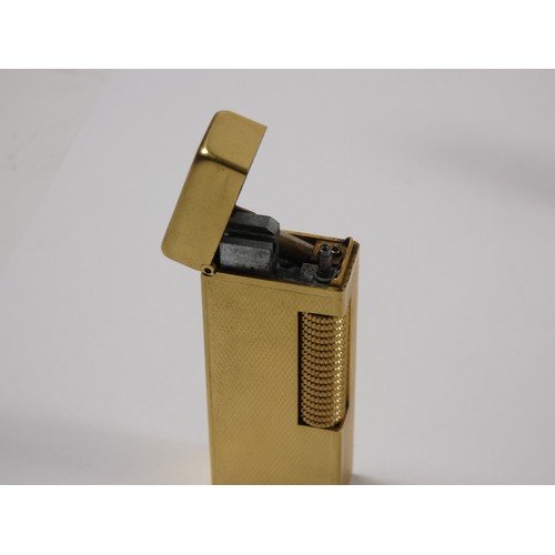 330 - A gold plated Dupont pocket cigarette lighter, together with a silver plated Dunhill 'Rollagas' ligh... 