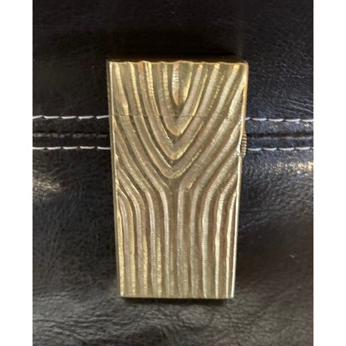 335 - A Dunhill 70 pocket cigarette lighter, gold plated with bark effect decoration.