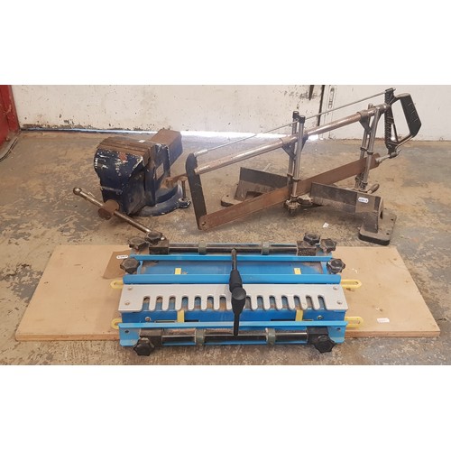 8 - A large bench vice, together with a mitre saw and a bench pipe bender. (3)