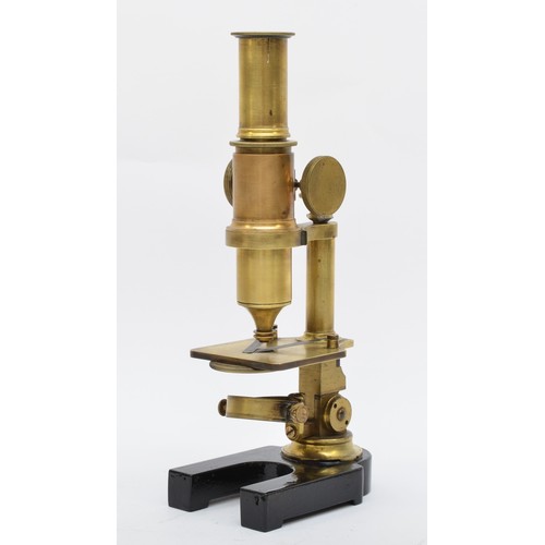 313 - A brass microscope, unnamed, with optic, also include several blank glass slides