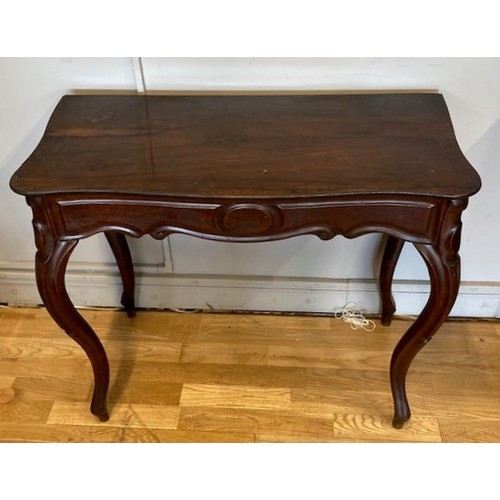 51 - A 19th century George II style mahogany console table, the moulded top with re-entrant corners above... 