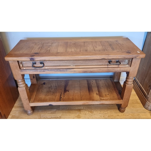 57 - A pine side table with long frieze drawer over a pot shelf, 110 x 76 x 45cm