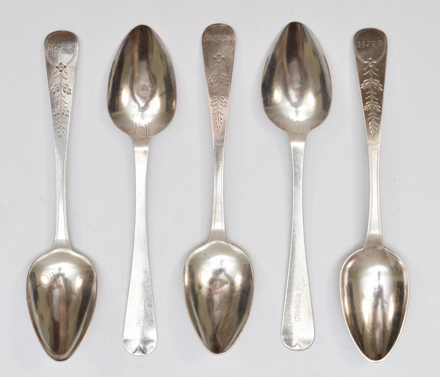 Jersey silver; a silver set of five bright cut tea spoons, by John le ...