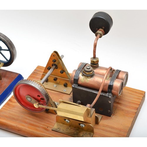 360 - Two live steam models, both presented on wooden bases, both in the form of pistons, brass hardware, ... 