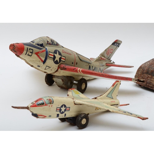 364 - A collection of tinplate toys, to include a Japanese made Demon Navy F3H-2N fighter jet, a similar s... 