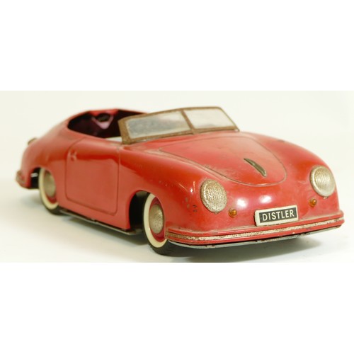 373 - A Distler Electromatic 7500 tinplate car, made in West Germany, in the form of a Porsche, red, with ... 