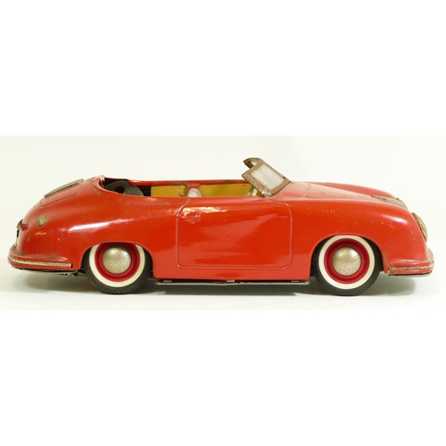 373 - A Distler Electromatic 7500 tinplate car, made in West Germany, in the form of a Porsche, red, with ... 