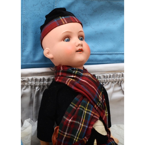 382 - An Armand Marseille 390 Scottish child doll, with blue sleeping eyes, lacking wig, jointed compositi... 