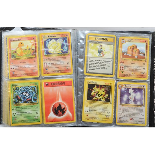 389 - Over 100 Pokemon cards, including holographic cards, together with 10 Digimon cards, presented in a ... 