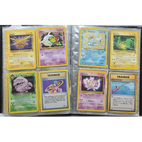 389 - Over 100 Pokemon cards, including holographic cards, together with 10 Digimon cards, presented in a ... 