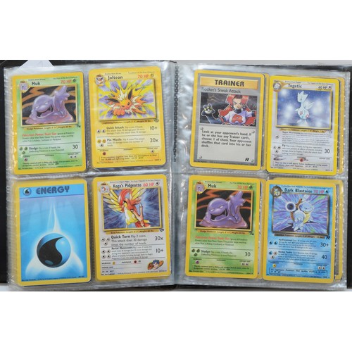 389 - Over 100 Pokemon cards, including holographic cards, together with 10 Digimon cards, presented in a ... 