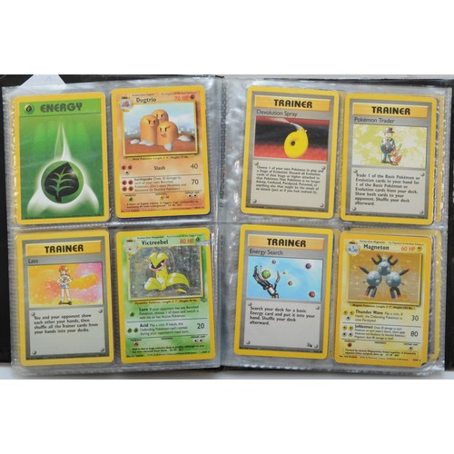 389 - Over 100 Pokemon cards, including holographic cards, together with 10 Digimon cards, presented in a ... 