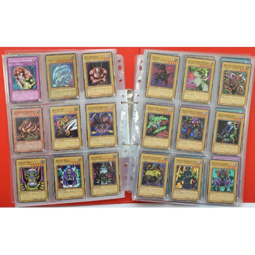 390 - A collection of Yu-Gi-Oh! cards, believed to be the original 200 cards, including foils, together wi... 