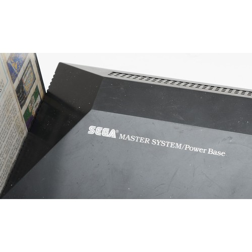 396 - A Sega Master system console, power base (serial No 40J 09714), with power and AV cables, two contro... 