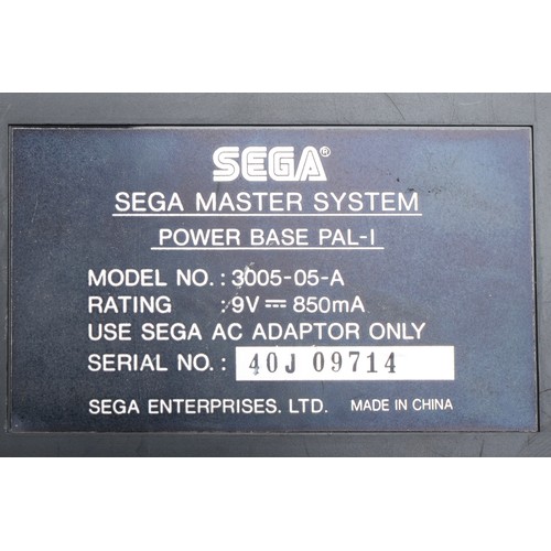 396 - A Sega Master system console, power base (serial No 40J 09714), with power and AV cables, two contro... 