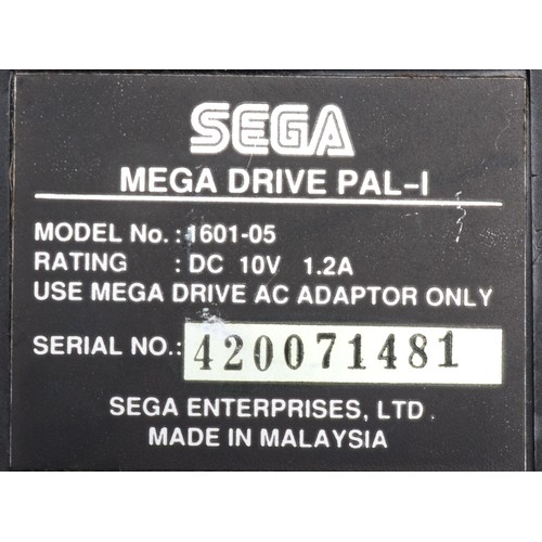 397 - A Sega Megadrive (serial No 420071481),with power and AV cables, two controllers, together with six ... 