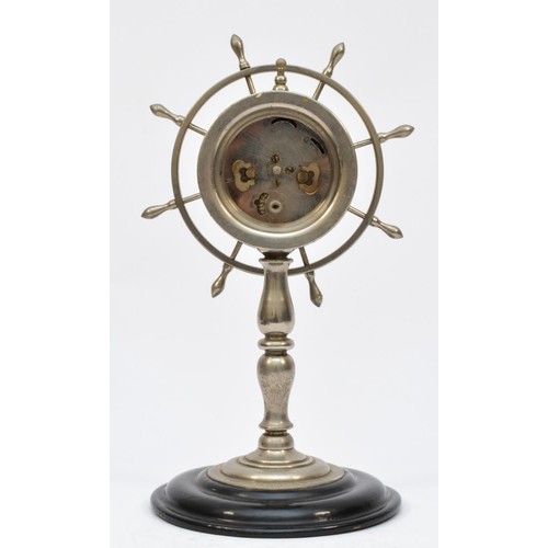 408 - A novelty presentation chromed desk clock, in the form of a ships wheel, raised on a Japaned base, 2... 