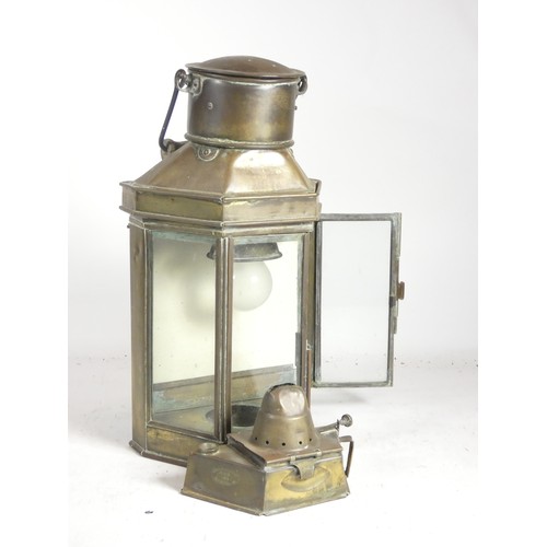 414 - A brass ships lamps, , brass with three glazed sides, compete with burner, stamped Howes & Curley 19... 