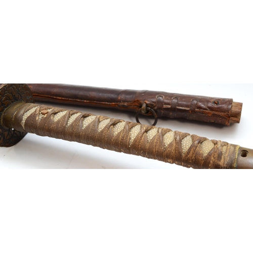 435 - A WWII Japanese Samurai Katana sword, with fish skin and woven cotton hilt, brass tsuba with floral ... 