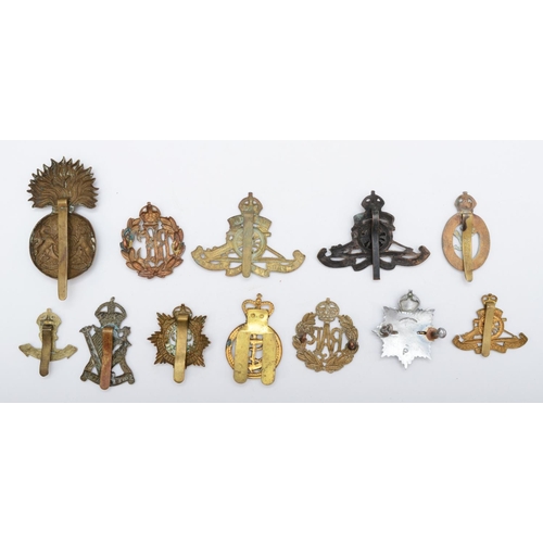 437 - A collection of 12 military cap badges, to include RFC and the Scottish Fusiliers.