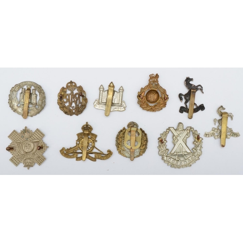 438 - A collection of 10 military cap badges, to include Cameron and Royal Marines.