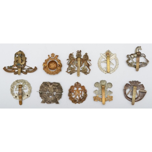 440 - A collection of 10 military cap badges, to include RAF and London Scottish