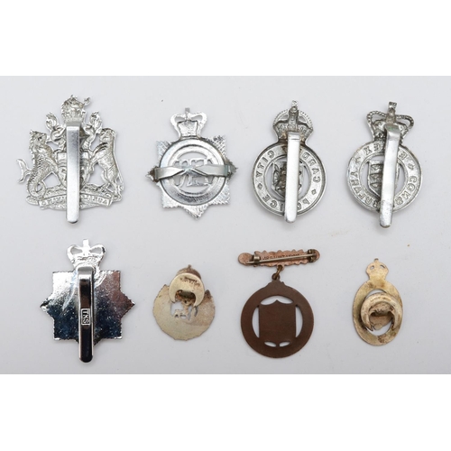 442 - A collection of 8 Police cap badges, to include Sussex