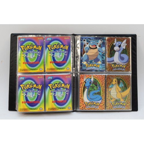 394 - A collection of Pokemon merchandise, to include binders (two of them without cards), stickers, two T... 