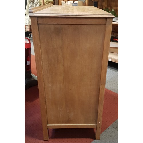 58 - A light oak chest of drawers, four graduated drawers with cast brass handles, 92 x 94 x 46cm