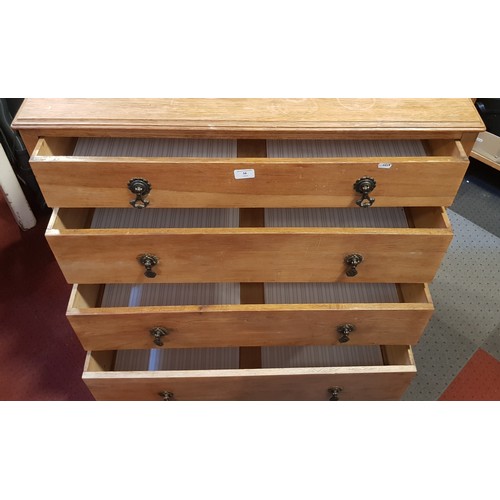 58 - A light oak chest of drawers, four graduated drawers with cast brass handles, 92 x 94 x 46cm