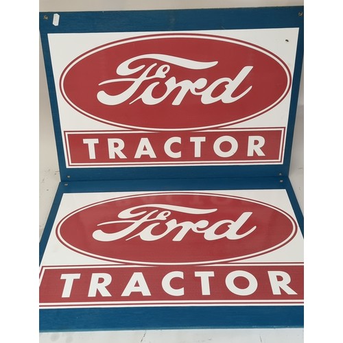 61 - A large white painted board with stickers, 80 x 168cm and two Ford Tractors stickers on board.