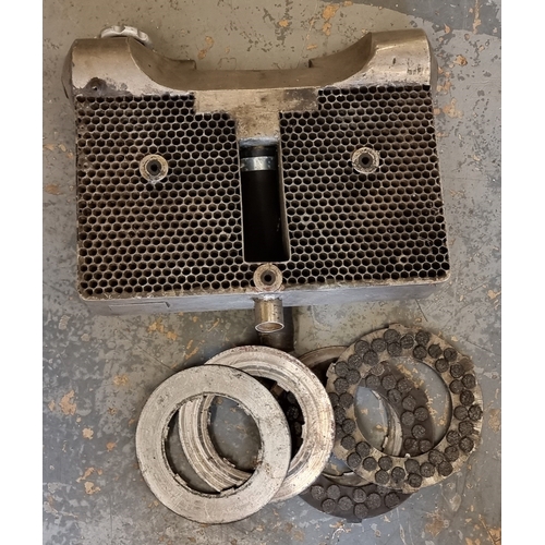 104 - A Scott radiator and clutch plates.