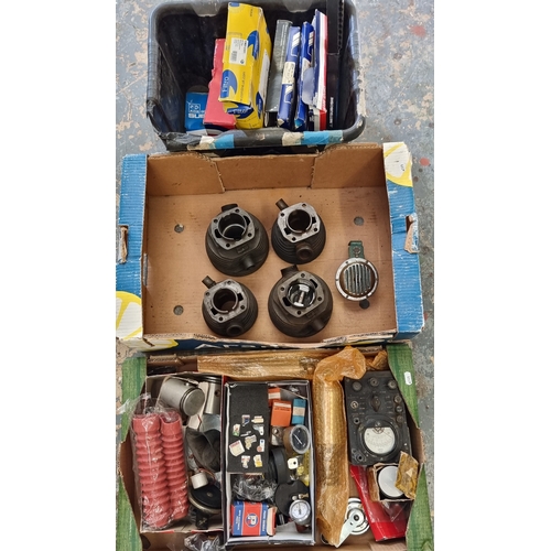 122 - Four Villiers barrels, pistons and rings, a pair of NOS stock shock absorbers and other spares