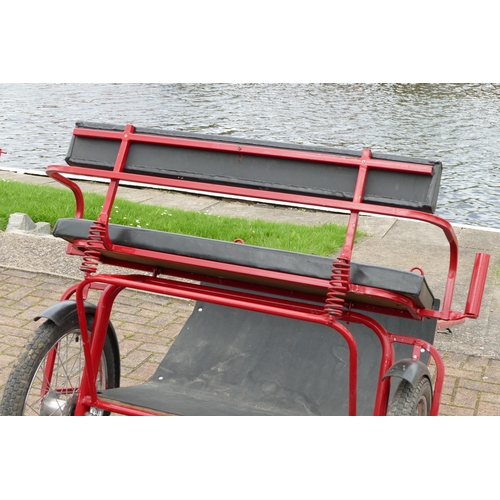 151 - A red painted horse/pony exercise cart, with English leather harness