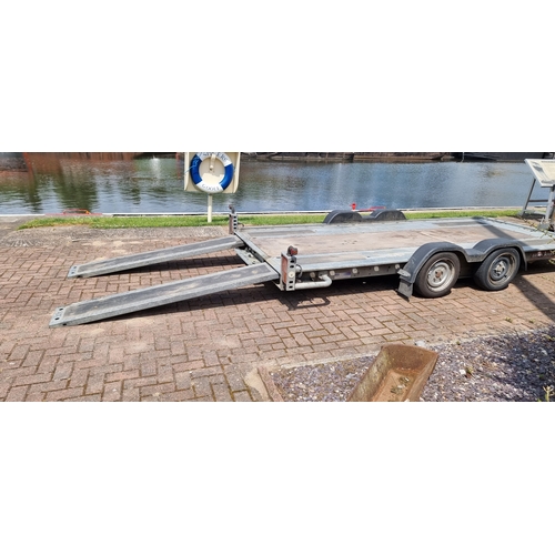 155 - A Brian James twin axel car trailer, 1600kg load, with pull out ramps and locking tow hitch with win... 