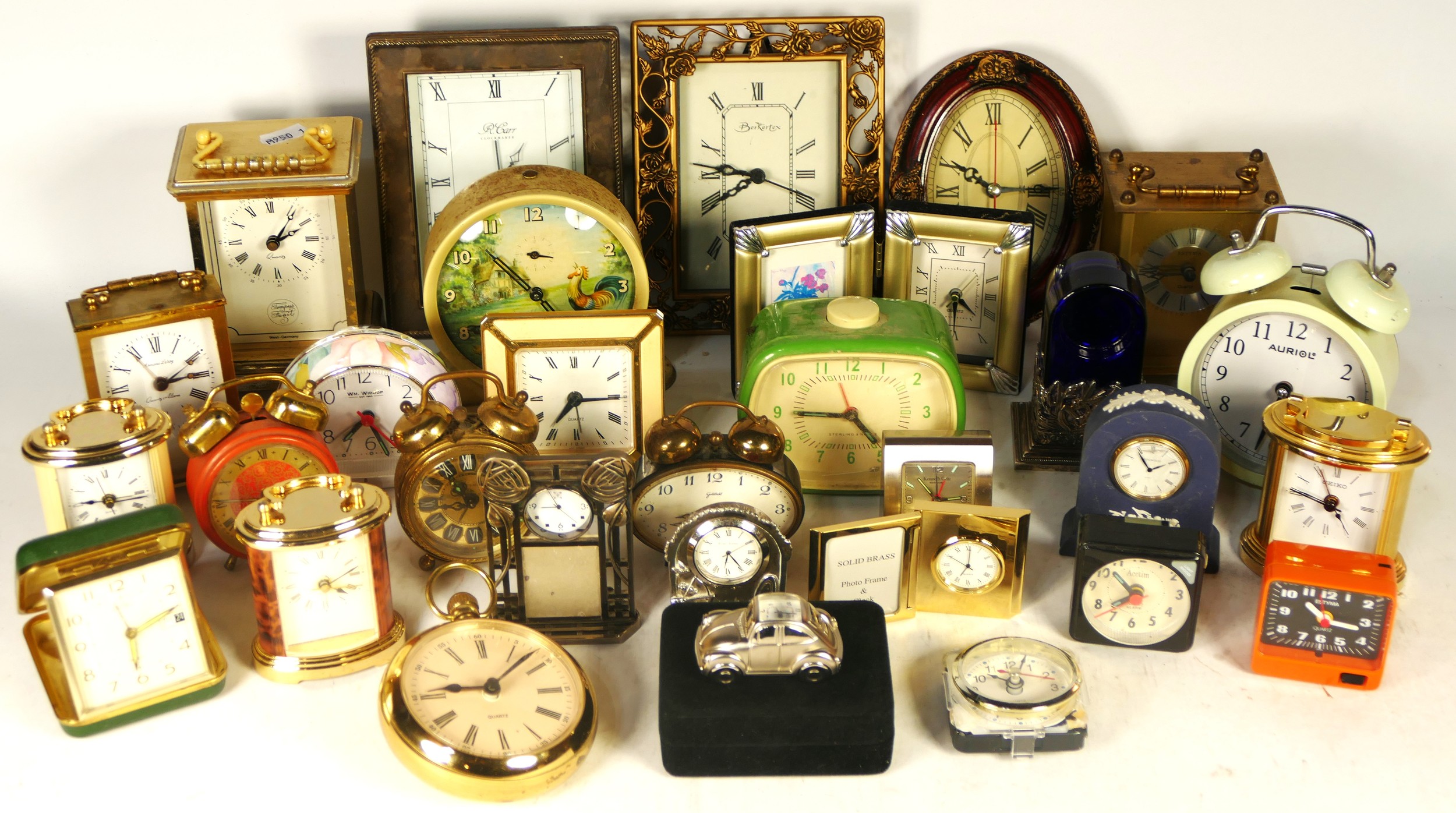 A collection of mid 20th century and later clocks, to include traveling ...