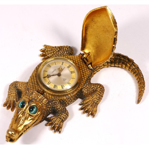 A novelty bedside/desk alarm clock in the form of a crocodile, gilt ...