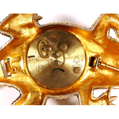 A novelty bedside/desk alarm clock in the form of a crocodile, gilt