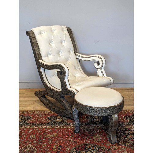 298 - A substantial cream leather rocking chair, with middle eastern inspired metal work decoration, possi... 