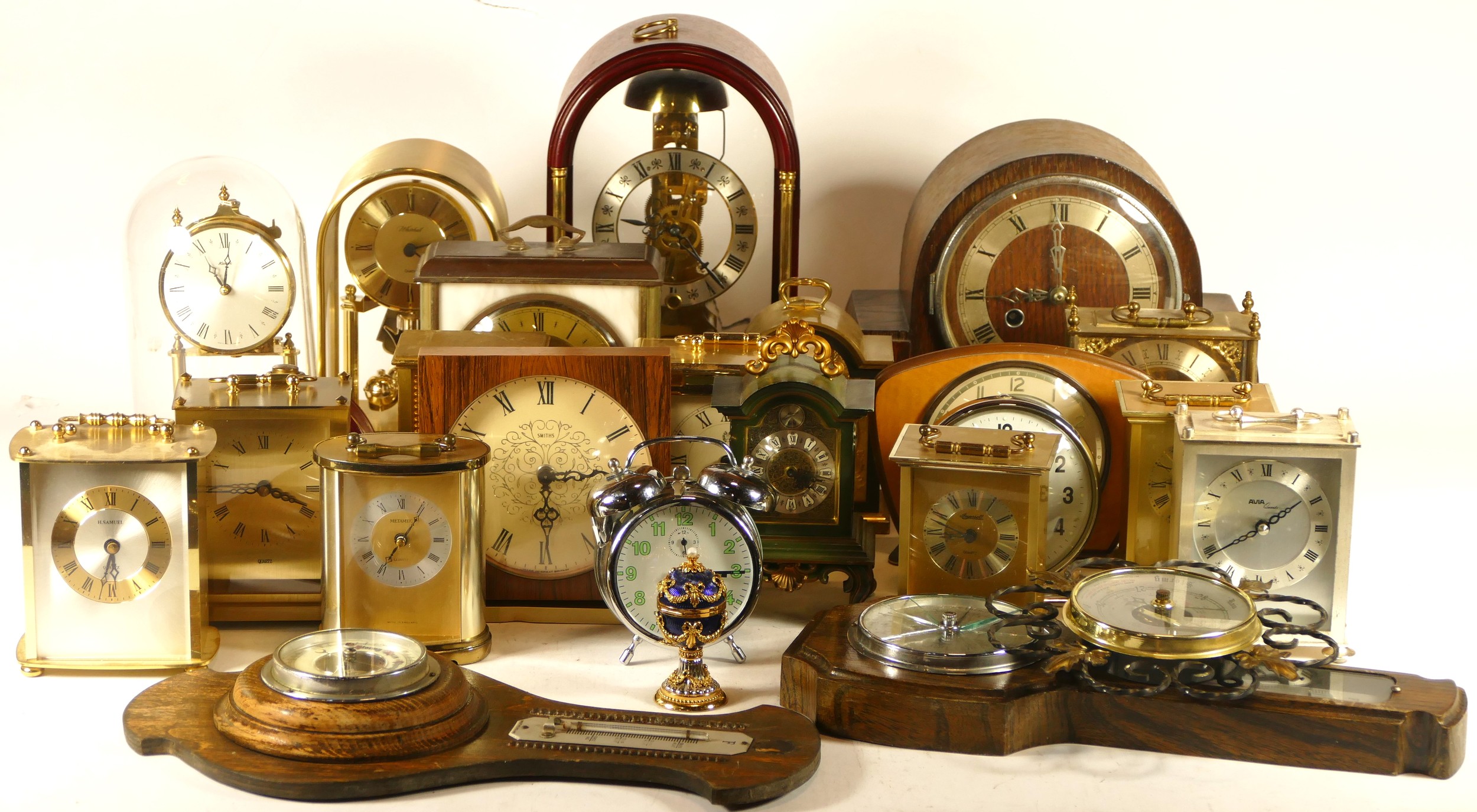 A collection of quartz and mechanical clocks, to include an Ingersoll ...