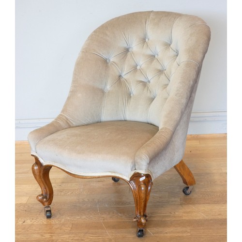A Victorian walnut framed spoon back salon nursing chair with