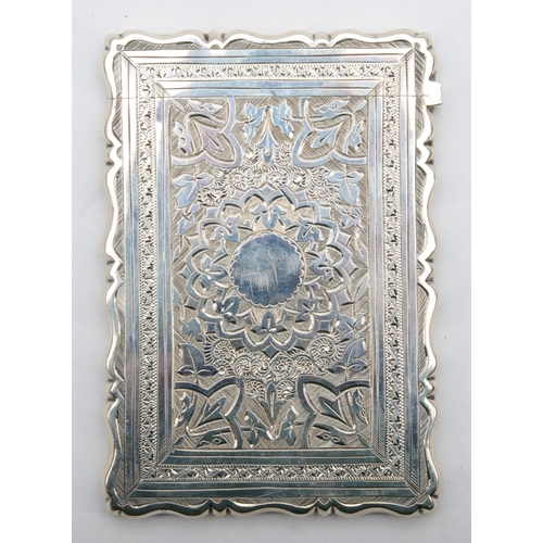 24 - A Victorian silver card case, by George Unite, Birmingham 1881, with all over floral and scroll deco... 