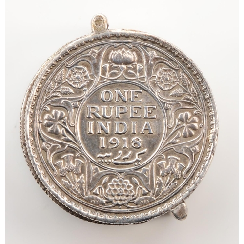 23 - An Indian silver coin container, c.1920, made from two silver One Rupee coins, 1918/19, hinged, with... 