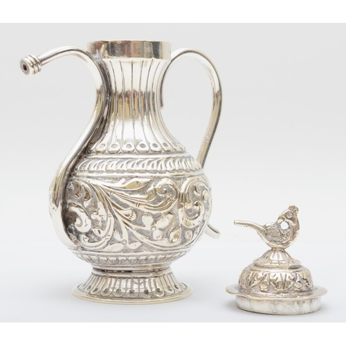 22 - An Indian silver long spout pot, stamped 925, with embossed and chased decoration, 13.5cm 199gm