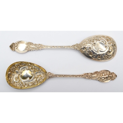 2 - A Victorian silver pair of embossed and chased serving spoons, London 1898, cast handles with cherub... 